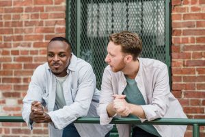 two men discussing lymphatic compression therapy